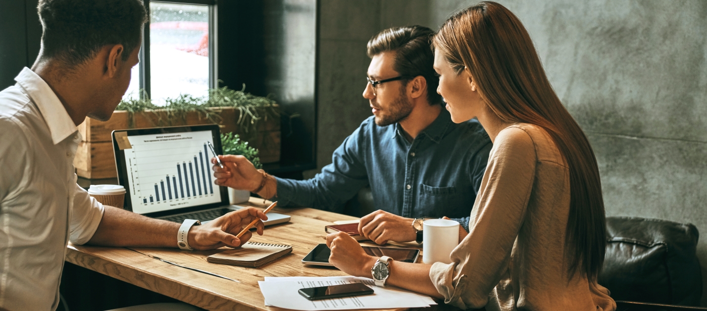 people talking in front of computer