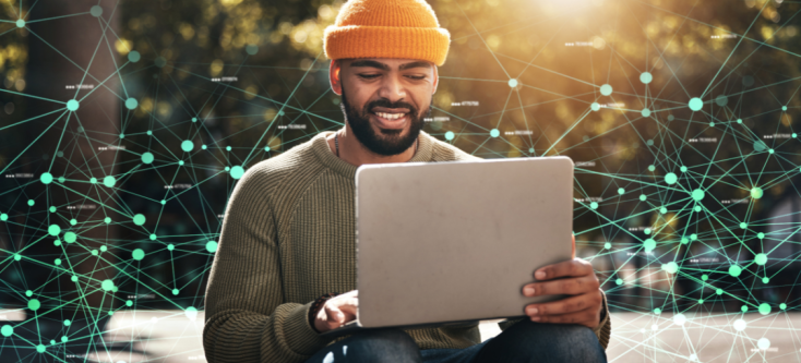 Researcher sitting outside on a bright day, working on a laptop, with datapoints overlayed on top of the image. Chercheur travaillant sur son ordinateur portatif lors d’une journée radieuse; des points de données sont superposés sur l’image.